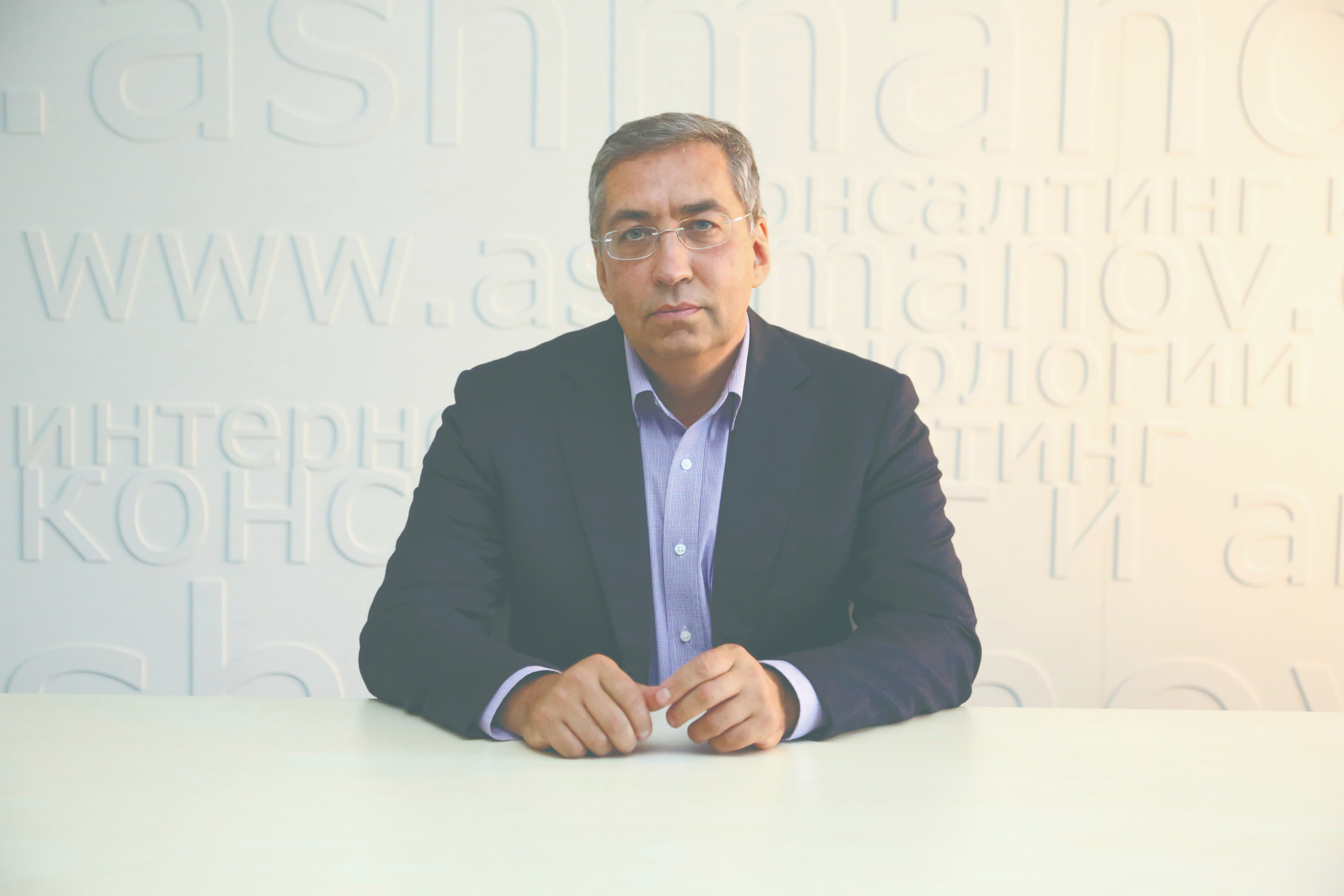 A image of a concrete sphere, balanced between two other larger spheres